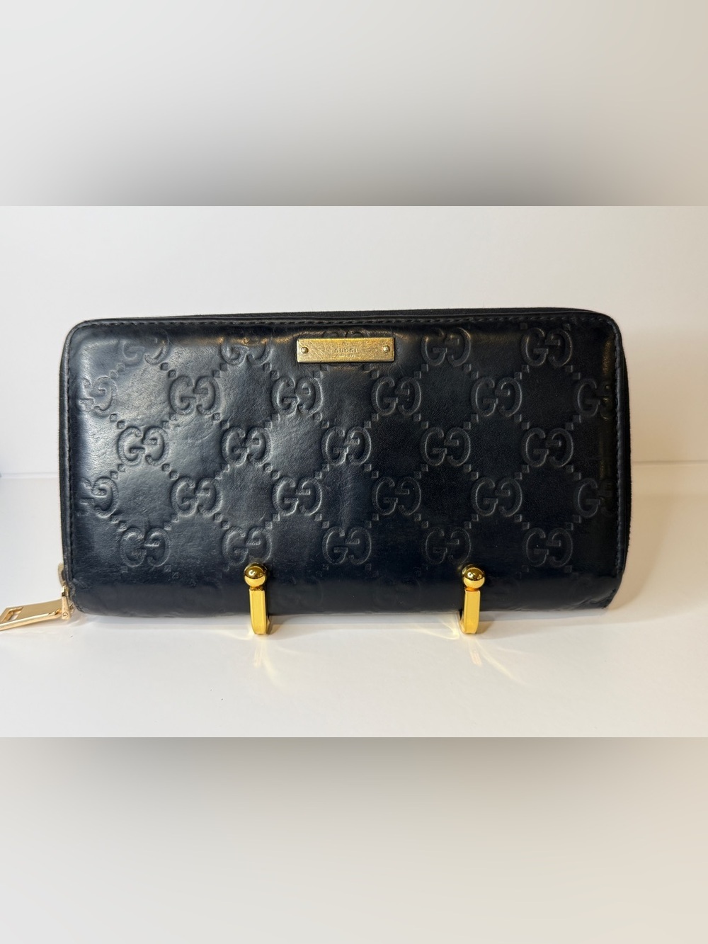 Gucci Black Embossed GG Leather Clutch with Gold Accents
